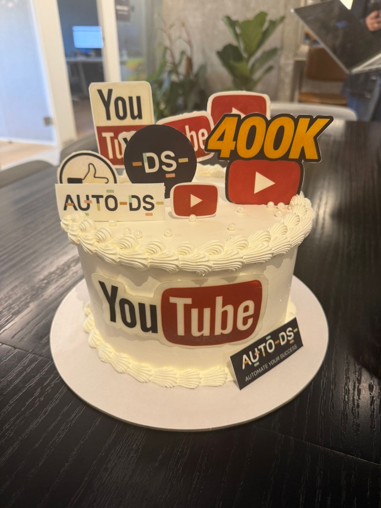 AutoDS 400K subscriber celebration cake with the YouTube logo
